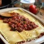 Bison sauce mixture on lasagna noodles.